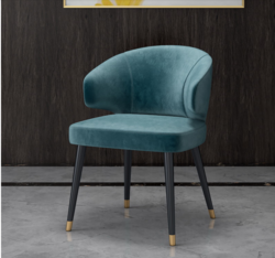 Colorful velvet dining chair with blue seat and black metal legs.