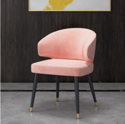 Colorful velvet dining chair with blue seat and black metal legs.